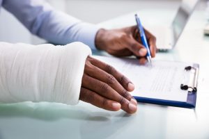 injured person signs papers